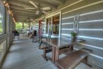Main Floor Screen Porch Picnic Table and Two Rocking Chairs